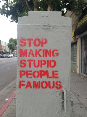 Street-Art-Stop-Making-Stupid-People-Famous-by-Plastic-Jesus-in-Los-Angeles-1.jpg